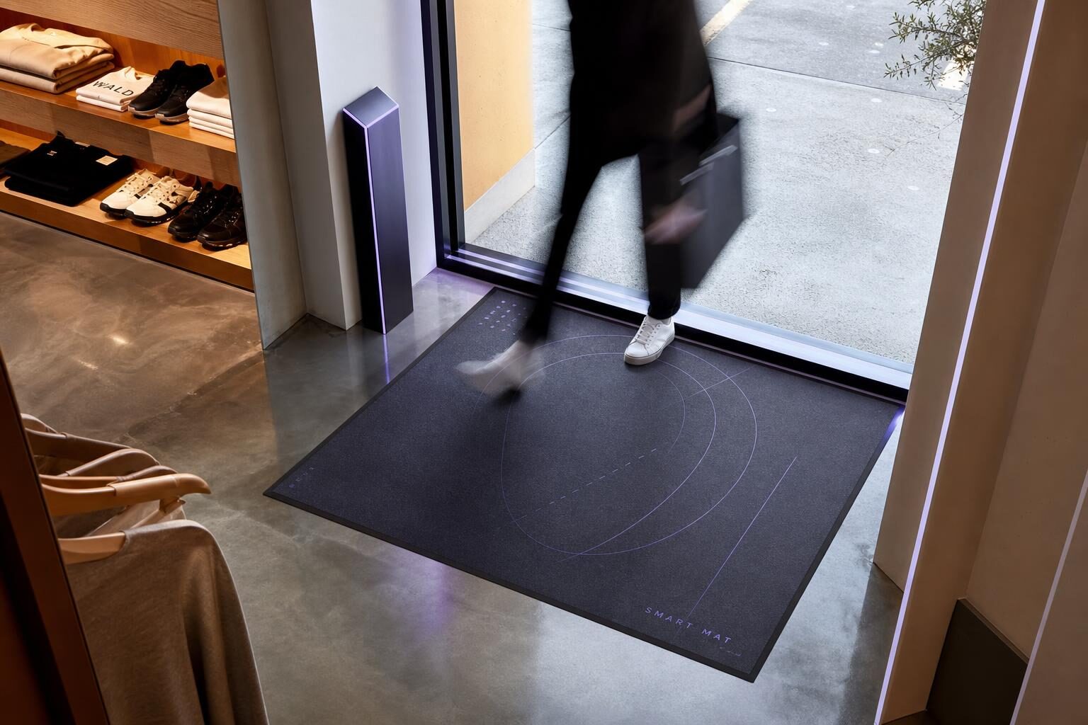 Modern retail storefront entrance with ASC smart mat counting anonymous shopper footfall